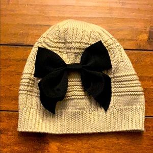 Kate Spade Tan knit hat with black bow